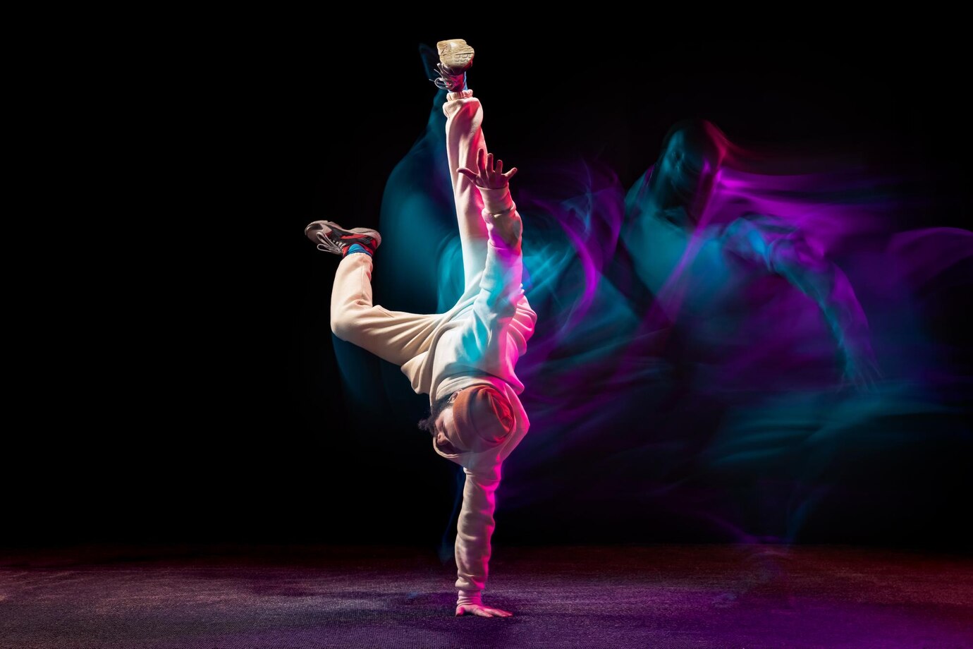 young-sportive-man-daancing-breakdance-isolared-black-backgrounf-neon-with-mixed-lights_155003-45629